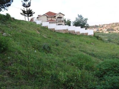 Buyer carefully reviewing documents to avoid a property scam in Rwanda
