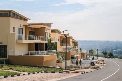Person reviewing land title documents before a property purchase in Rwanda