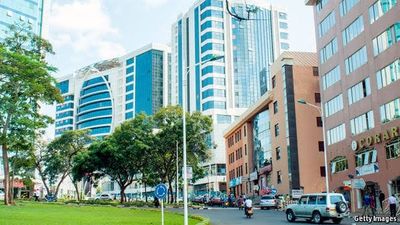 Buyer signing legal documents to purchase a house in Kigali, Rwanda