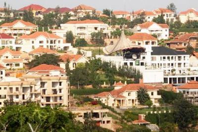 Buyer reviewing a property sale agreement in Rwanda before signing